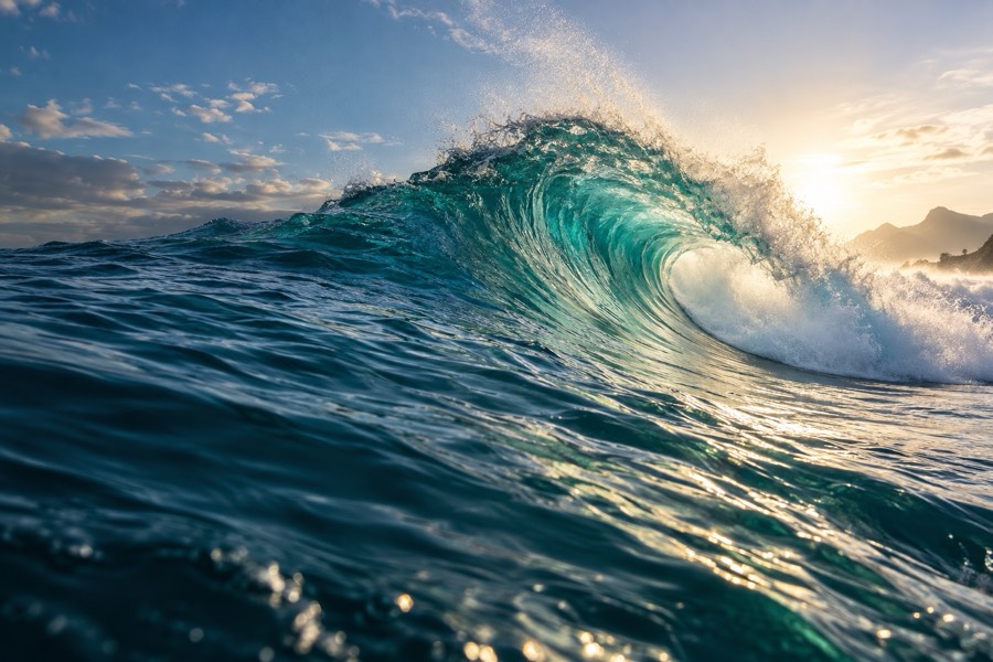 Open Waves title art: a turquoise wave pitching at sunset